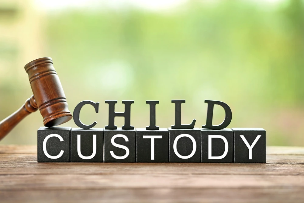 Words "child custody" with a gavel on them.